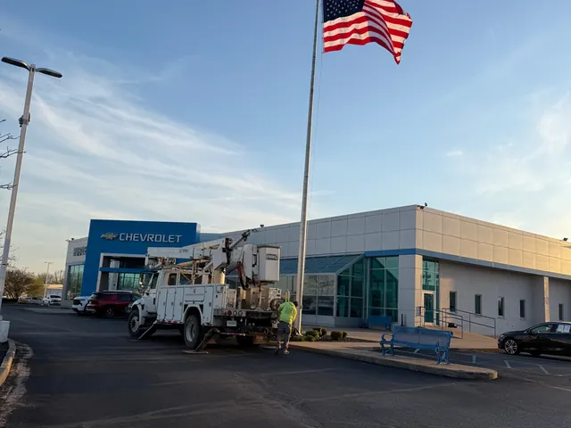 Dealership frontage install with the service truck on site.