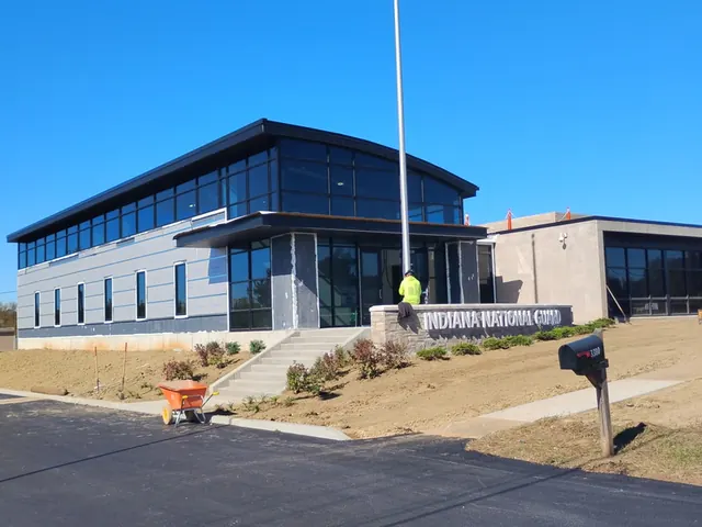 New commercial flagpole being installed outside an office building in Indiana