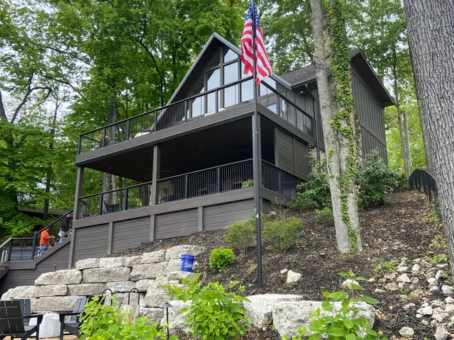 Residential flagpole at a home on wooded sloping ground in southern Indiana